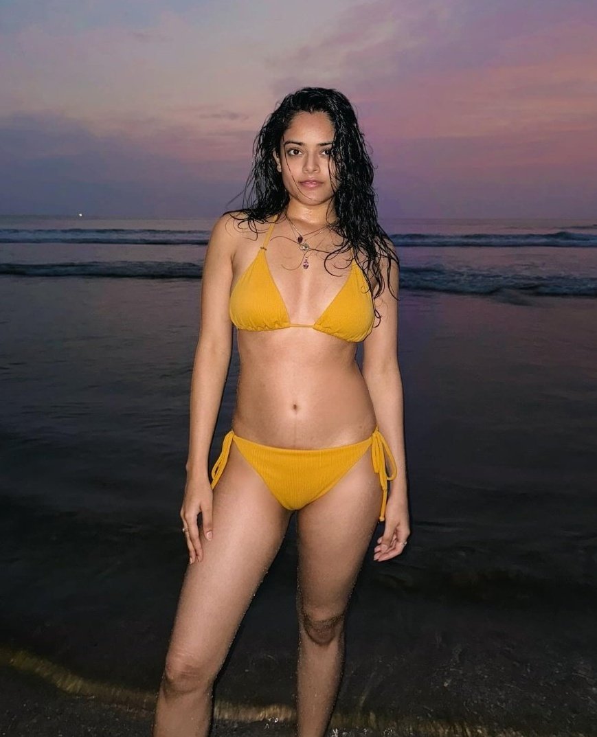 Riddhi Kumar in a bikini under ocean lights