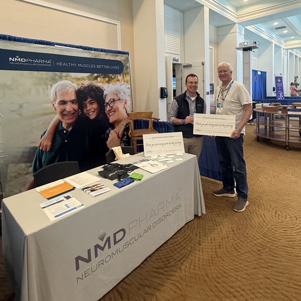 NMDPharma's tweet photo. Earlier in the week starting on Sunday afternoon, NMD Pharma joined patients, clinicians and advocates from across the myasthenia gravis (#MG) community in Hollywood Beach, Florida for the 6thAnnual @MyastheniaOrg (MGFA) National Patient Conference.

NMD Pharma’s Dan Brennan and our Patient Community Advisor Jeff Selby shared information at an exhibit table about the NMD Pharma SYNAPSE-MG clinical trial for those with generalized myasthenia gravis (gMG) that are experiencing muscle weakness and fatigue despite existing treatments. Jeff Selby an adult SMA patient who was a participant in the SYNAPSE-SMA clinical trial, helped engage in meaningful discussions with patients and caregivers about the experience of participating in #ClinicalTrials and the importance of participating in clinical research for new and unique treatments. It was great to see such strong engagement from the MG community, with many valuable conversations and a high level of interest in the study.

Thank you to everyone who stopped by to connect with us. We remain committed to advancing research, improving outcomes, and helping create a brighter future for people living with MG and other neuromuscular diseases.

For those with MG or their friends/family who would like to learn more about our SYNAPSE-MG clinical trial, please visit this site to “See if You Qualify”: https://t.co/nSmBGqMoYn

#MGFA #MyastheniaGravis #NMDPharma #NeuromuscularDisease #ClinicalTrials #Innovation