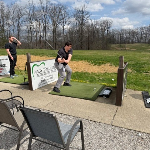CAMCEMedIAM's tweet photo. This week's journal club took the Vandalia Health CAMC Emergency Medicine residents to the driving range! There, they practiced their swings and enjoyed pizza while discussing articles. https://t.co/1cvi8kIEKM