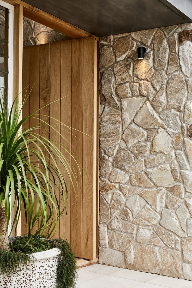 Natural stone + warm wood = instant curb appeal.

Modern entryway inspiration with clean lines &amp; organic texture.

arnoldmasonryandlandscape.com

#Masonry #HomeDesign #CurbAppeal