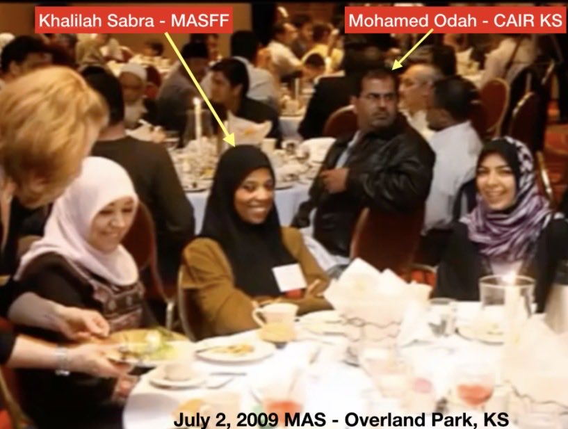 JLink58539's tweet photo. July 2, 2009 - MAS-KC fundraiser, Overland Park Marriott, KS.
Jomana Qaddour (now senior State Dept Syria advisor) 
• Salah Sarsour (center w/ $65k+ cash stack; DHS-detained 2026, accused Hamas financier ties)
• Ahmed Shehata (named MB operative by Egyptian media)
• Khalilah Sabra (MASFF)
• Mohamed Odah (CAIR-KS)
• George Galloway (fresh off handing cash to Hamas)
• Mahdi Bray (MAS), Mohamad Albadawi, others from the ISGKC/MAS network under Hamed Ghazali.
Transparency matters. Full bios for public roles & taxpayer funds.