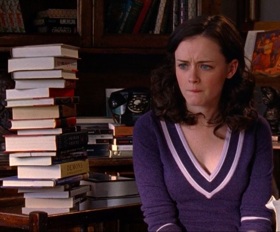 Me and the pile of books that can’t stop looking at me to pick them up.