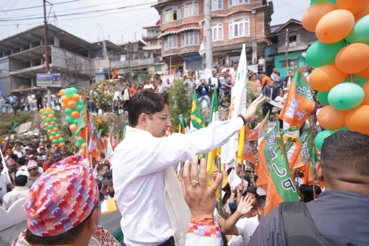 RajuBistaBJP's tweet photo. Today, I joined the people of Kalimpong at a massive Nomination Rally in support of our BJP Alliance candidate Sh. Bharat Chettri ji. 

Kalimpong was once known for trade and commerce and it was the most important trading center between Sikkim, Darjeeling, Bhutan, Tibet and even China. Kalimpong was also famous for its great schools. It was once a hub of agriculture, horticulture and floriculture. 

Today Kalimpong has become a shadow of its former self. The trade and commerce has come to a standstill. The students are leaving Kalimpong and going to other cities. Our youths are migrating in search of better opportunities. Cinchona Gardens and Tea Gardens are on the verge of shutting down. There are no employment opportunities for local youths. People living under the DI Fund system are being extorted with hefty fees by the TMC government. 

BJP Alliance will reverse this trend. We will protect our land, our identity and our future. We will ensure our educated youths won’t have to leave our beautiful place. We will create employment opportunities for them bring world class educational institutes to Kalimpong, and ensure that our agricultural sector, our horticulture and floriculture sector thrive.

For decades, Kalimpong suffered from acute water crisis.  thank PM Modi ji for sanctioning Rs 197 crore for Kalimpong Municipality under AMRUT 2.0. For Har Ghar Jal Kalimpong district got over 146 projects worth Rs 518.6 crore. Under PMGSY II and III Kalimpong district 89 roads of nearly 500 km at a cost of around ₹327 crore have been completed. For PMGSY IV 27 new proposals have been approved. 

Further, the Sevoke-Rangpo Rail Line is about to be completed. National Highway 717A is nearing completion. Damdim-Gorubathan-Lava Highway has been completed. Work has started for alternative to Coronation Bridge. NH-10 improvements is ongoing. The Chalsa-Jaldhaka-Bindu Road has been half completed. Eklavya Model Residential School is already functioning, and the 1st phase of Elevated Highway Corridor from Balason to Sevoke is about to be completed. 

Under the visionary leadership of PM Modi ji, Kalimpong and our Darjeeling hills, Terai and Dooars region have become a hub of development. 

This election is not just about wining or losing, it is more about accountability, development, and securing the future of our region. With your support, we can correct the current course and bring stability, opportunity, and growth back to Kalimpong. Hence, I request the people of Kalimpong to vote for BJP Alliance and ensure a massive victory for our candidate Sh. Bharat Chettri ji.