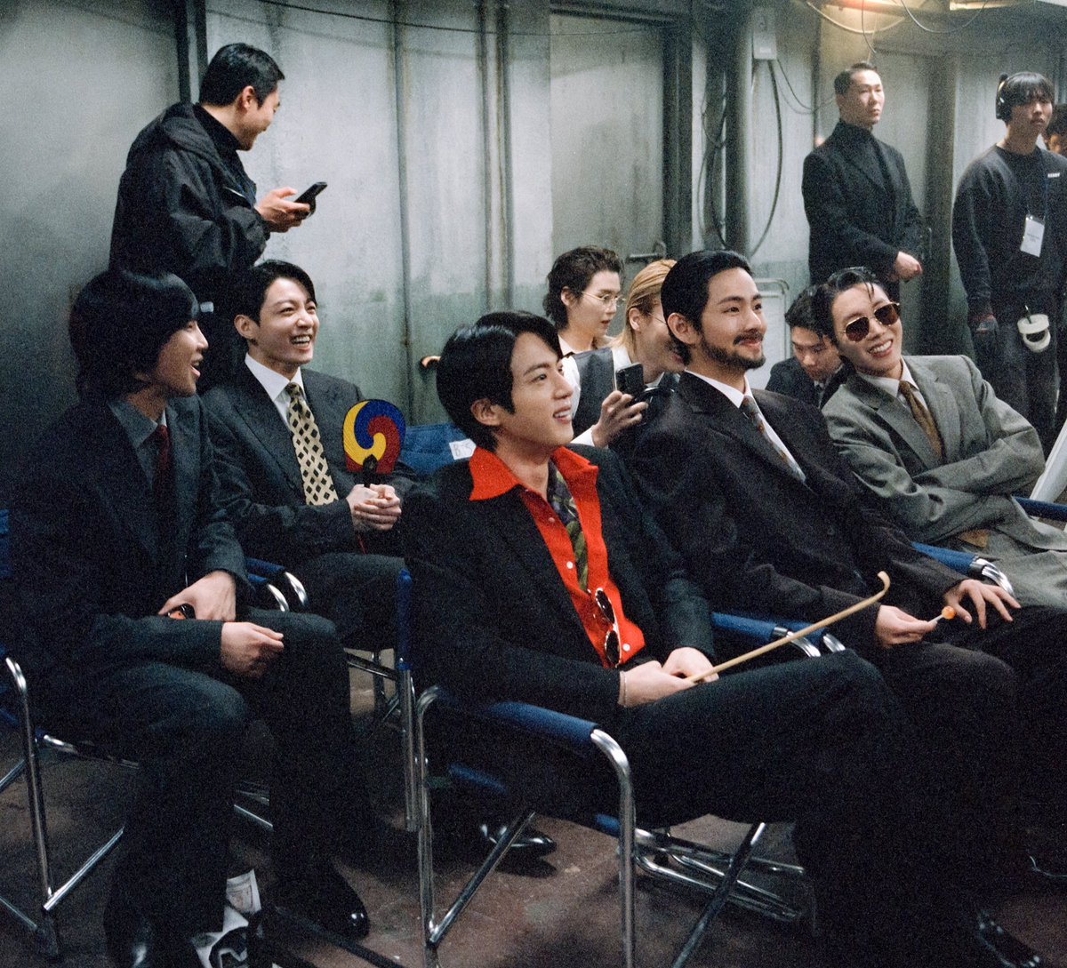 I think they are watching the clips. Look at their smile