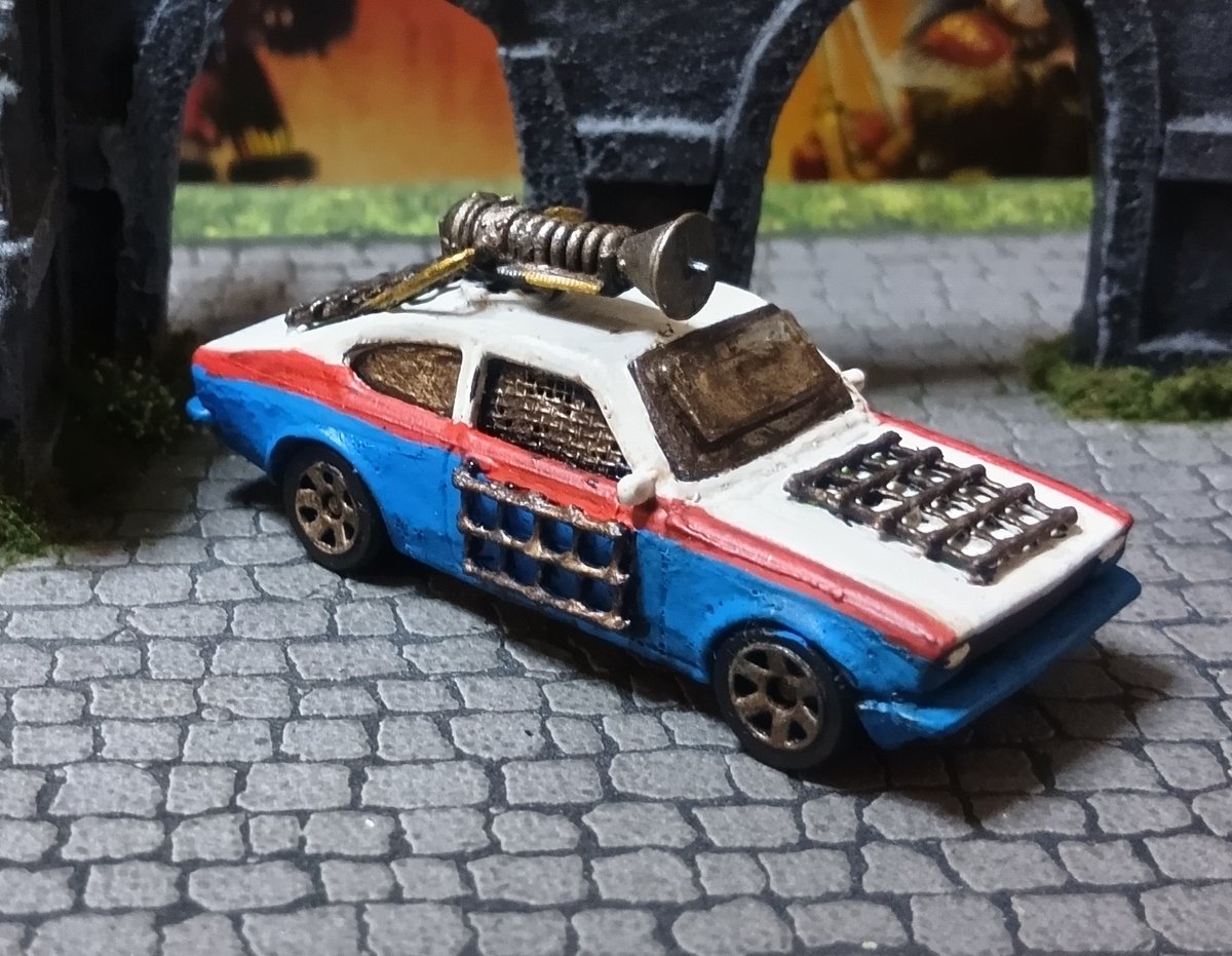 davidlee74's tweet photo. I have completed a fourth Gaslands team.  I am not keeping this one, it is a gift for a friend, but I am definitely going to face it on the racetrack.  I tried a few new things when doing these, the shattered front windscreen, and hand painting the roundels. https://t.co/FHKmqyE79w
