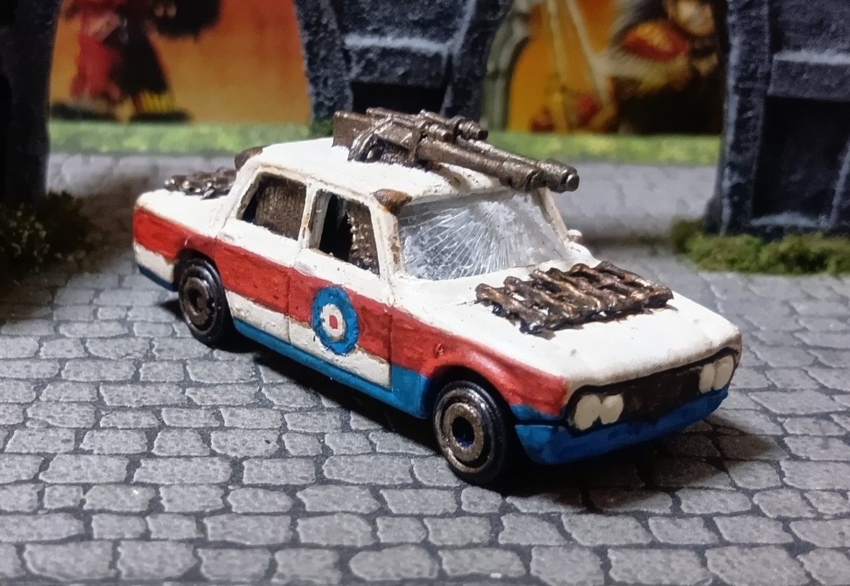 davidlee74's tweet photo. I have completed a fourth Gaslands team.  I am not keeping this one, it is a gift for a friend, but I am definitely going to face it on the racetrack.  I tried a few new things when doing these, the shattered front windscreen, and hand painting the roundels. https://t.co/FHKmqyE79w