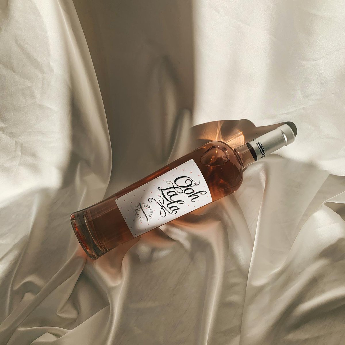 Anna000s's tweet photo. Slow, sun-drenched days: a cold bottle of rosé, soft light, and quiet moments. The sweetest escape 🤍#WineTime https://t.co/6p7Q8x5Uda