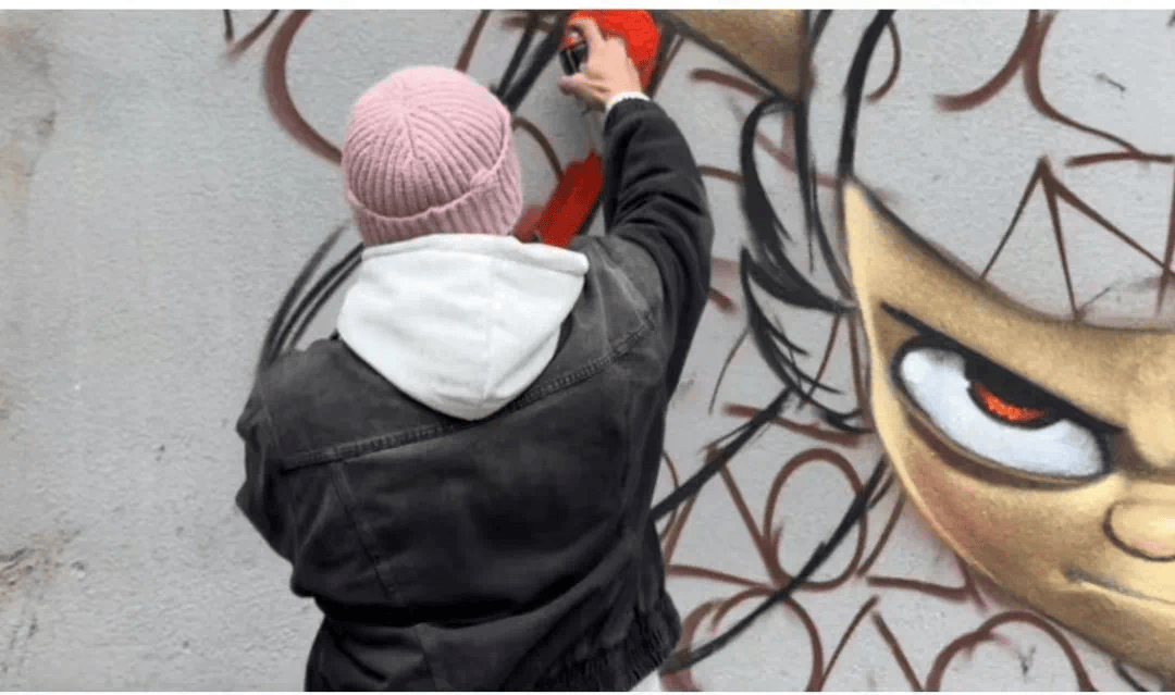 bradD51's tweet photo. Spotted a street artist turning a broken wall into a rainbow story.  The kid’s grinning—proof art finds joy in every crack. https://t.co/tw1AIwcxuV