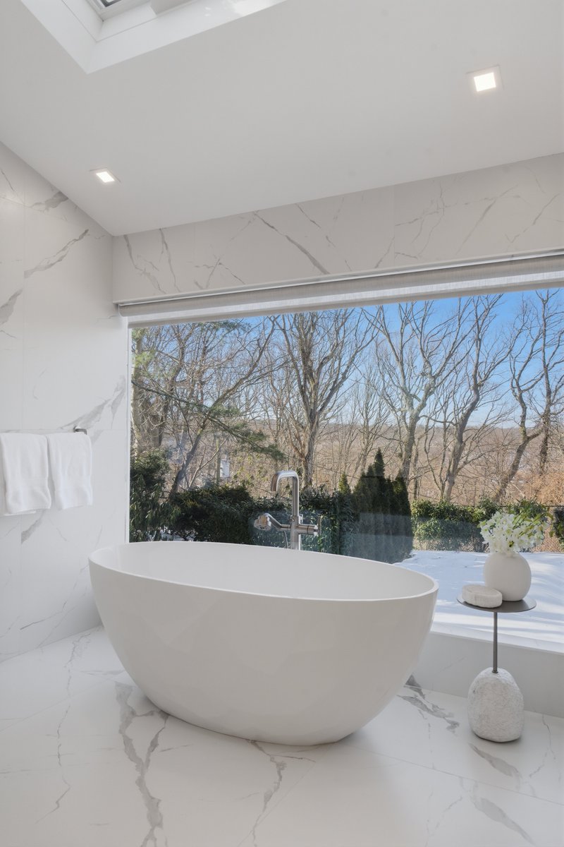bath_elite's tweet photo. Luxurious master bath remodel in Manhasset, NY. The free standing bath tub was a must for the spa like atmosphere our client so desired. Floor to ceiling window brings the outdoors in for a relaxing calm bath. https://t.co/D1Ys4QqoKG
