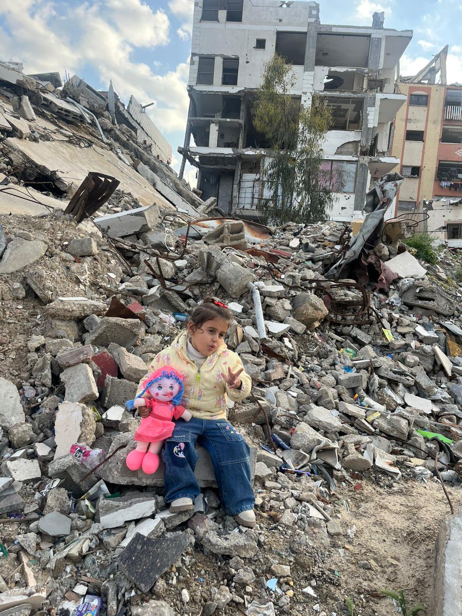 This is little angle Leen, the beautiful and resilient girl standing on the rubble in Gaza❤️❤️❤️