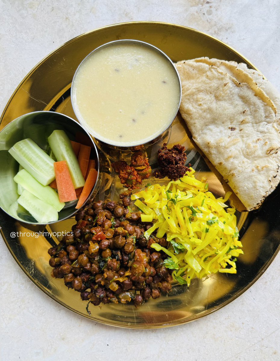 Lunch scenes today -

Masala chana
Cabbage sautéed
Sweet Kadhi
Jowar rotis
Tindli Achar &amp; chutney
Cucumber carrot