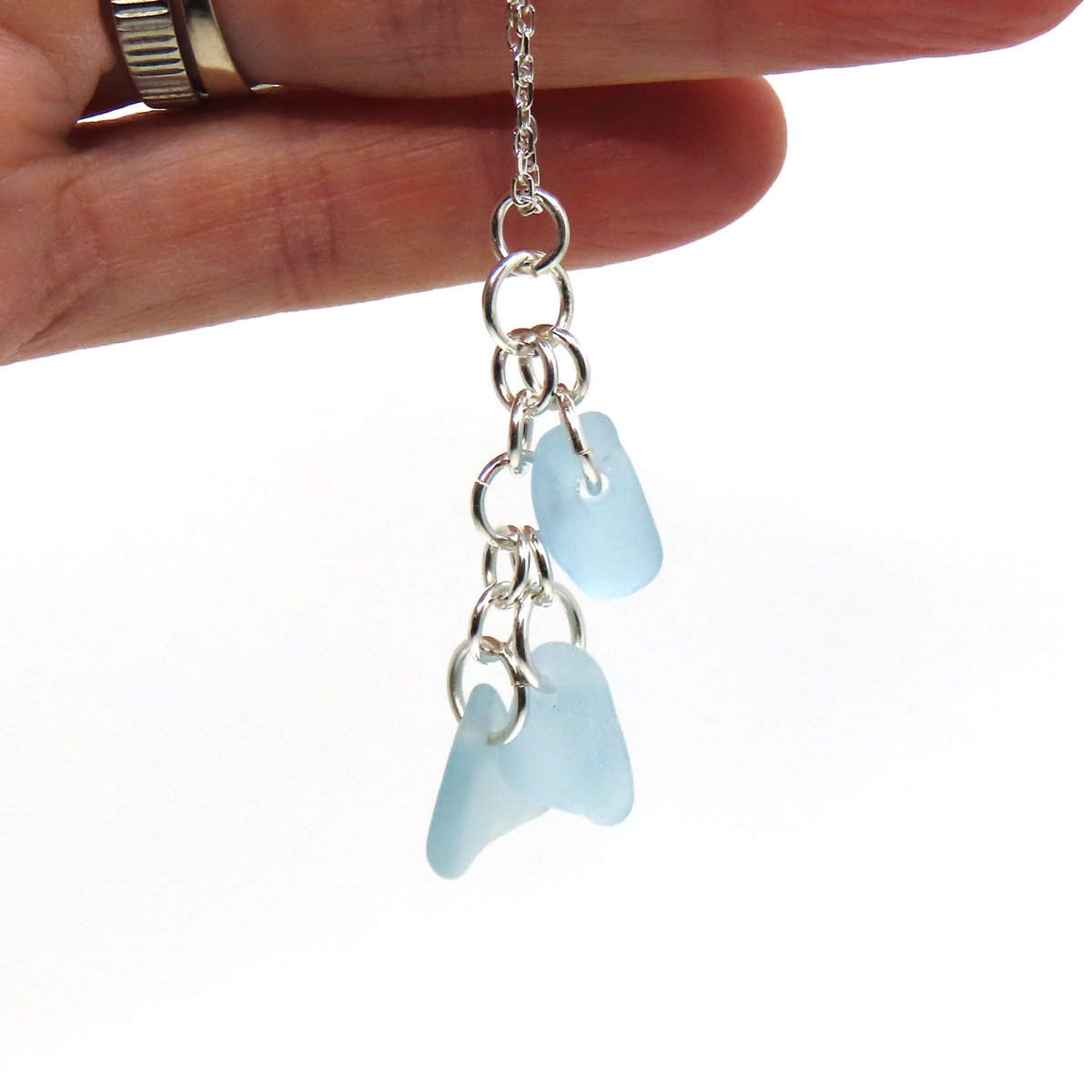 TheStrandline's tweet image. Delicate, timeless and beautifully handcrafted this cluster of three small pieces of powder blue sea glass suspended from sterling silver rings and hung on a sterling silver trace chain. 
 
thestrandline.co.uk/ourshop/prod_8…

#UKGiftAM #MHHSBD #giftideas #northumberland