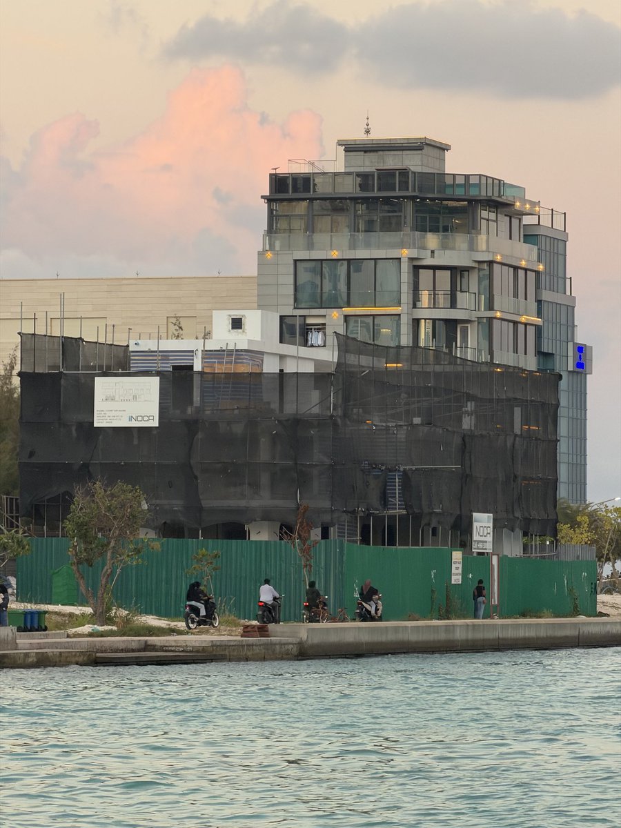 HathifHilmy's tweet photo. It is amazing to see the amount of people using the area around the canal as a social space. An outdoor space by the water to meet and enjoy with family and friends. The canal was destined to be even more magnificent, it was to pass through phase 1, 2 and 3 of Hulhumale, connecting the three with the main lagoon of Farukolhufushi. It would have been the perfect space for paddle boarding, canoeing, open water sports and swimming. 

However HDC under new management only saw commercial spaces to exploit, plots of land to be distributed, family spaces to monetize.  Now several three story tasteless rectangular concrete buildings are propping up, HDCs new vision for Channel Park is unfortunately a food court. This is what happens when the only vision is making a quick buck!