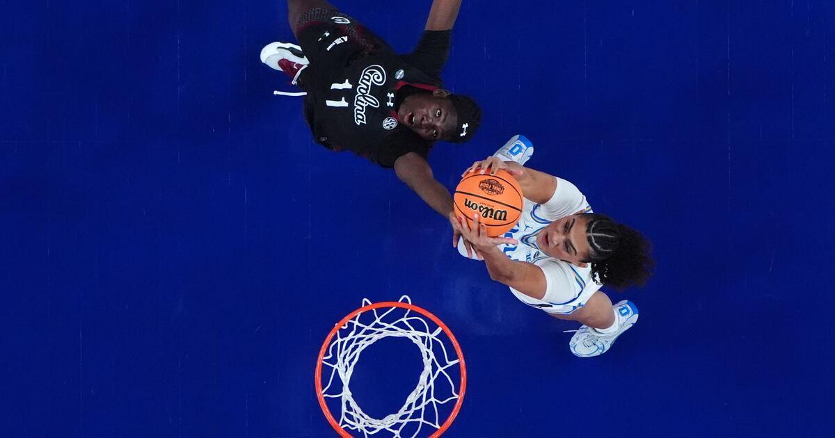 WHIORadio's tweet image. Staley embraces UCLA's Close ahead of title game, then smirks to the crowd after handshake drama whio.com/sports/staley-…