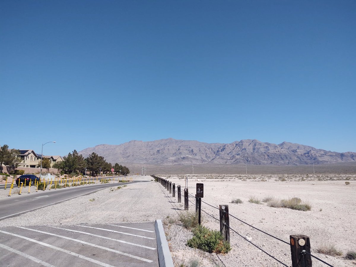RealJCWarren's tweet photo. The edge of civilization in northeast Las Vegas where the new construction stops and the Tule Springs Fossil Beds National Monument begins. Exposed sediment layers from -570,000 years of environmental change. Hot Vegas use to be a patchwork of marshes, shallow lakes, and streams. https://t.co/QsAWEcFP4z