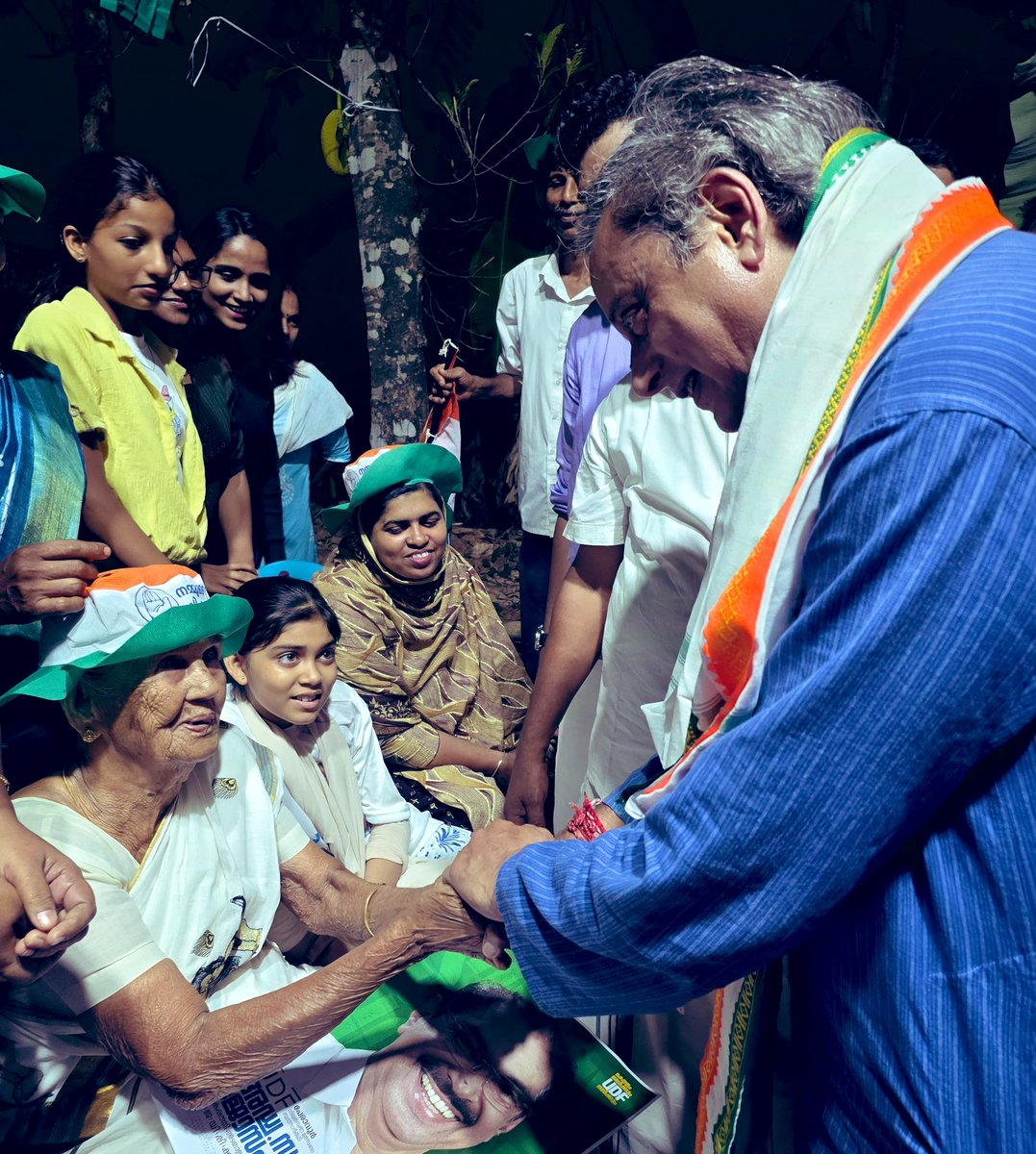 ShashiTharoor's tweet photo. Spotted this remarkable 88-year-old lady in the crowd waiting patiently for us to speak. Went down from the stage to enquire about her well-being and seek her blessings for our candidate. Such loyalty is what @incIndia is built on. And it will take @INCKerala to victory in the #KeralaElection2026 !