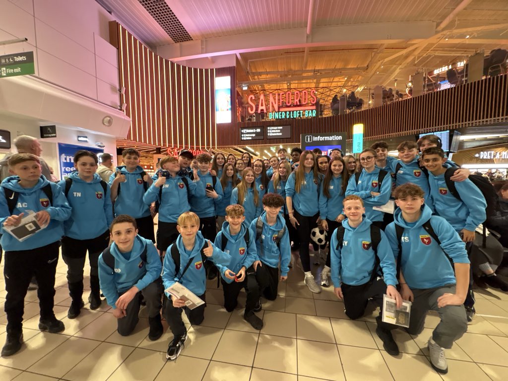 Sports Tour 2026 checked in and waiting to board our flight    Image