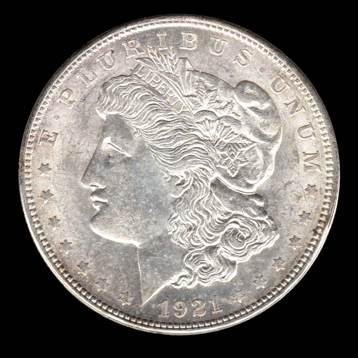 rocketdog632's tweet photo. A 1921 Morgan Dollar minted in Denver. Interesting coin and very affordable to show the location of the mint mark on the reverse of the coin right beneath the ribbon.  #Coins #USA #Silver https://t.co/cD7wINXqM2