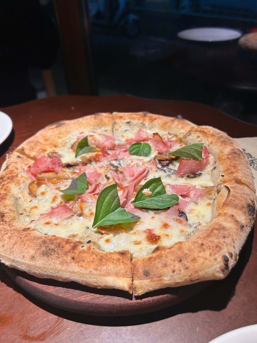 Collegzzz's tweet photo. [NEW]  Festive Truffle u0026 Prosciutto Pizza (Limited Time Only!)  Creamy white sauce, wild truffle shavings, paper-thin prosciutto, and melted mozzarella—perfect for holiday gatherings! Grab yours before it’s gone at [Restaurant Name]! https://t.co/ahzSWQCbOa