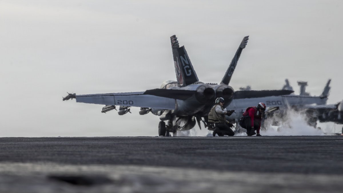 sentdefender's tweet photo. An F/A-18E "Super Hornet", attached to Strike Fighter Squadron (VFA) 14,  launches from the flight deck of Nimitz-class aircraft carrier USS  Abraham Lincoln (CVN-72) during Operation Epic Fury, March 31, 2026. https://t.co/MKHDT5mVRw