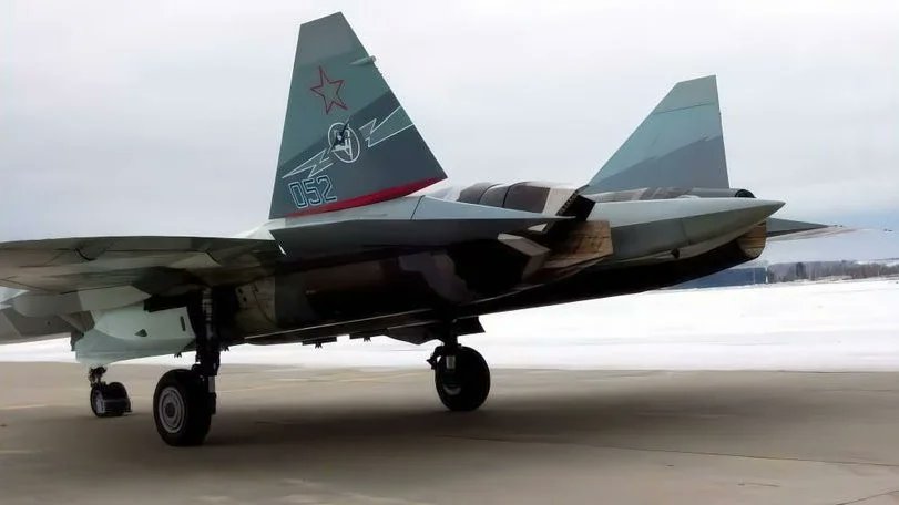 Tracking_Live's tweet photo. 🇷🇺 Russia has developed a flat, two-dimensional (2D) thrust-vectoring nozzle variant for the Su-57🤯

For Russians, it represents a notable shift towards enhanced rear-aspect stealth. Historically, they have relied on axi-symmetric (which we also call circular nozzles) nozzles, which are less effective at masking radar and heat signatures.

The Key Features of this new Flat Nozzle:

1. The new flat design is expected to reduce rear-aspect RCS and IR signature (It helps in masking the turbine face and improves exhaust mixing with cooler bypass air, lowering infrared visibility).

2. Unlike the F-22, whose 2D nozzles primarily move in the vertical plane, the Su-57 variant appears to use multiple control flaps. (as per our study, this ensures enabling enhanced multi-axis thrust vectoring (mainly pitch and roll, with limited yaw contribution).

3. A performance trade-off is expected. Flat nozzles typically incur some thrust loss compared to circular designs, but this is considered acceptable for improved survivability and rear-aspect stealth.

4. The design is reported to incorporate significant use of additive manufacturing (3D printing). (which may help reduce weight and production complexity).

5. The nozzle is intended to work with the advanced AL-51F-1 (Izdeliye 30) engine, which is expected to deliver higher thrust (around ~180 kN class with afterburner) to offset efficiency losses.

-Public Reveal: A prototype and scale model of the upgraded variant, associated with Su-57M/Su-57E, was displayed at the Dubai Airshow in November 2025.

The flat nozzle variant of the Su-57 is currently in the testing phase and is not in operational service with the Russian Aerospace Forces (VKS).

The system is reported to be under evaluation, with no confirmed full-scale operational flight deployment yet 
(This research was done and made on publicly avl information and confirmed/reliable sources)

It'd be really nice if we got a SU-57 flat nozzle variant for IAF, what do you think????