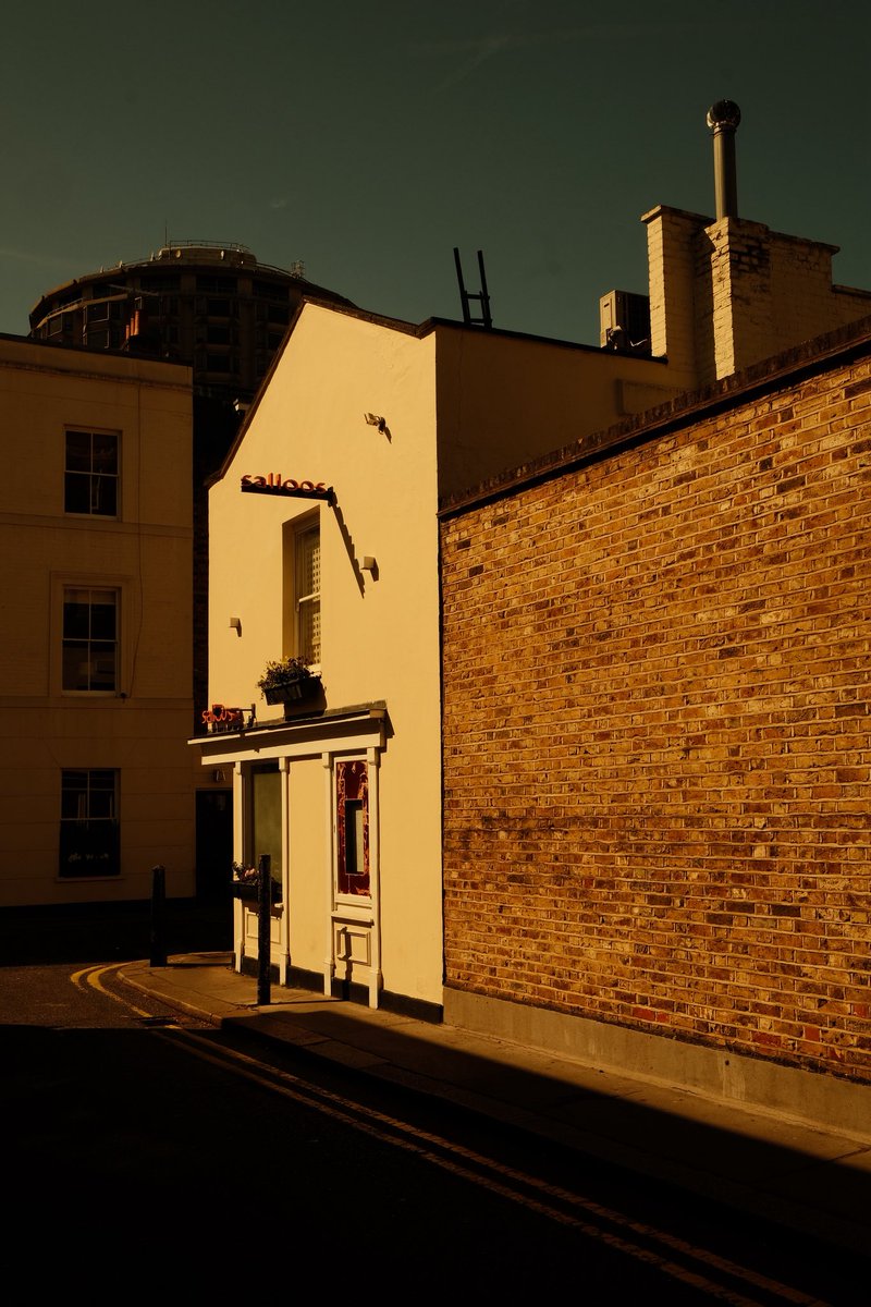 London_W4's tweet photo. Corner shop, Belgravia, London. Everything looks better in the sunshine and although I’ve walked by here numerous times before, today I just really loved the light and the shadows. A boring street scene maybe, but I like it. https://t.co/HhE8XqwkH4