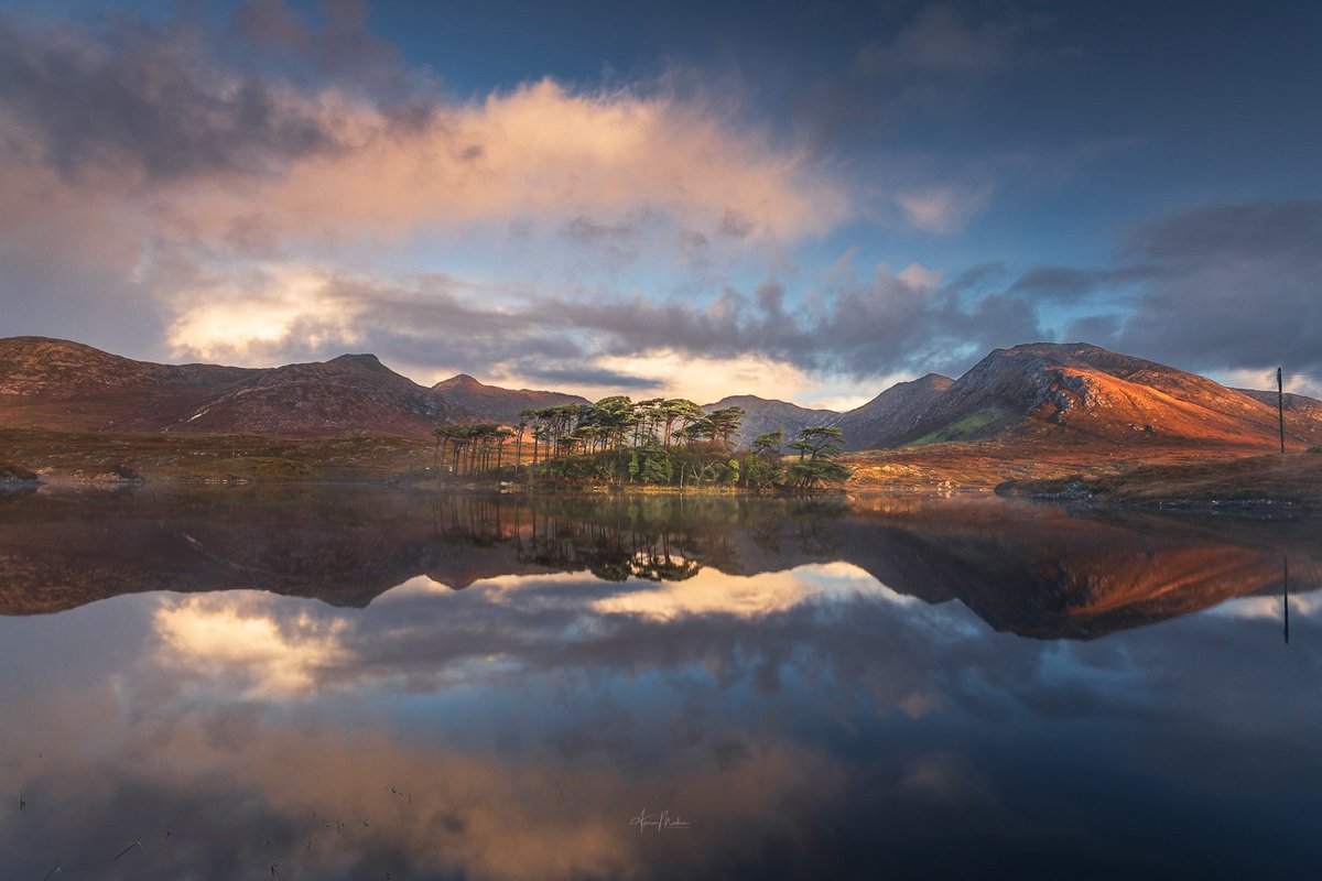 Crystal clear sunrise reflections on the well photographed pine island. This was taken on a lovely autumnal morning after a few showers. Pity there was little mist but the gorgeous morning colours more than made up for it. 
#photography #landscapephotography