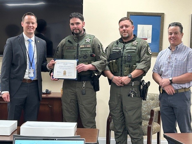 NCDOIFraud's tweet photo. Our Assistant Director Joshua Falls presented K9 Deputy Elmendorf of the Mecklenburg County Sheriff’s Office with our Partnership and Collaboration Award. 
This award recognizes individuals who make a meaningful impact in combatting fraud and protecting North Carolinians. https://t.co/K979OsIfJK