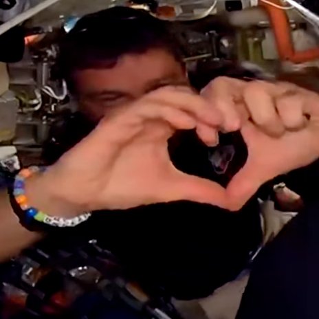 kate_tice's tweet image. Reid saying hi to his two daughters visiting Mission Control Houston (the bracelet is from them), just minutes before the Artemis II crew proposed to name a lunar crater after his late wife, Carroll.  
Cue Crew group hug and tears (there and here, too)  😭
