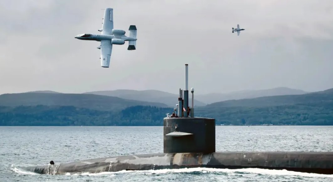 Valor_Gear's tweet photo. The A-10 Warthog—that lovable flying tank from the 1970s—just won’t quit. With Operation Epic Fury underway, dozens of Hogs are overseas again, now pulling double duty: shredding ground targets and blasting Iranian suicide boats and suspicious floating targets like a true maritime menace.
So naturally, the big question is: Will the Navy slap a tailhook on this beast and create the Sea Hog for carrier ops?
It would probably be an engineering nightmare… but yes. Yes, there should absolutely be a Sea Hog. The fleet needs more ugly, gun-slinging chaos
