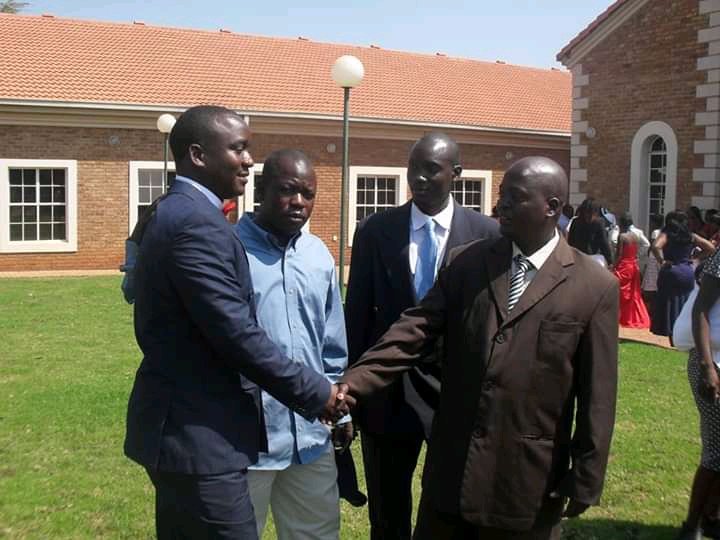 kasindi_raphael's tweet photo. @grok edit the pic and leave the guy in brown suit https://t.co/pXIMLkPrHe
