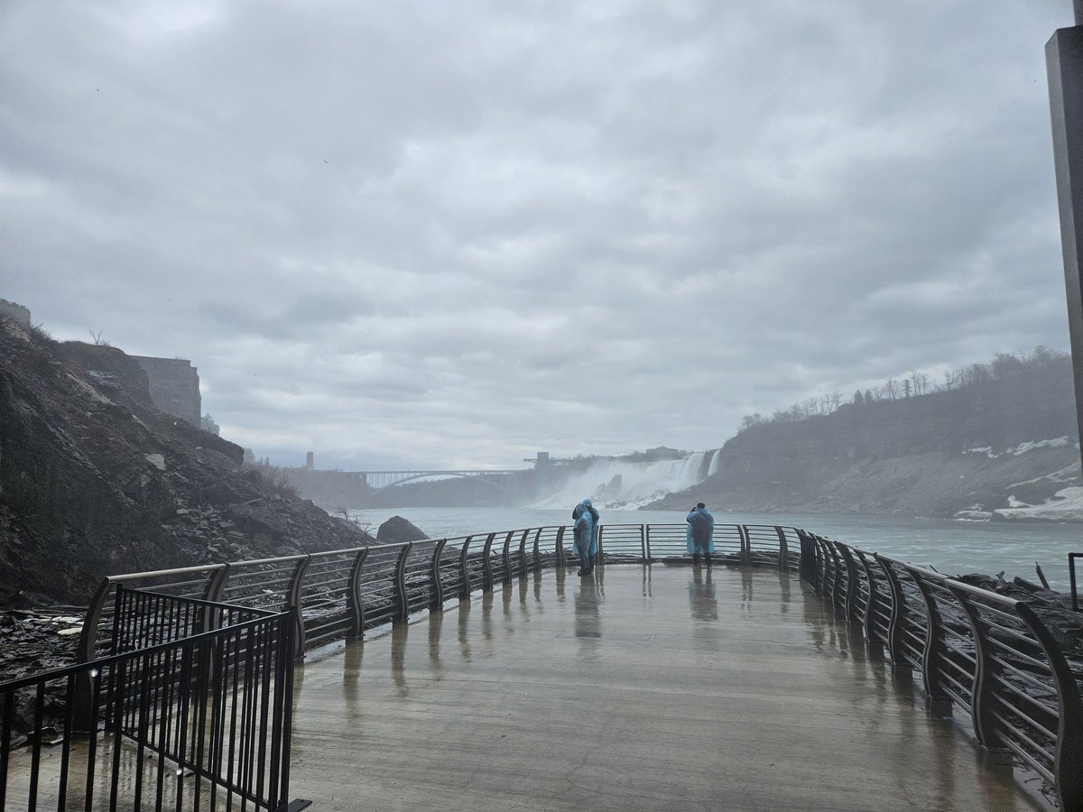 Rakhshanda_27's tweet photo. The Tunnel at the Niagara Parks Power Station is a 670-metre (2,200-foot) long historic underground passage that once served as the "tailrace" for the Canadian Niagara Power Company. 
You reach the tunnel by descending 55 metres (180 feet) in a glass-walled elevator that offers views of the station's hidden underground decks.The passage is a smooth, illuminated walkway through the original brick-lined tunnel as shown.
The Viewing Platform: The tunnel ends at a newly constructed panoramic observation deck. This platform sits at the river's edge, providing a unique, low-angle perspective of both the Horseshoe and American Falls.