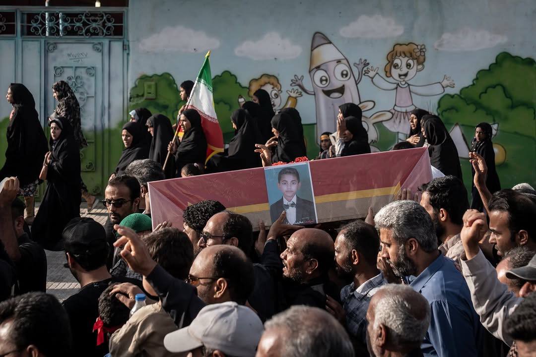 IRTruePromise's tweet photo. Yesterday, saw some tweets crying about 4 people stuck under the rubble for 6 hours in Israel.

Here's the funeral procession of the young Iranian student Mohammad Taha Jafari, one of the martyrs of the Minab school massacre whose body was recovered after more than 30 days of the US–Israel airstrike on a school in Minab, that killed about 165–175 children aged 7–12.