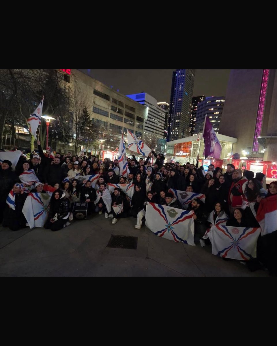 AssyrianAidCA's tweet photo. A heartfelt thank you to everyone who visited the CN Tower lighting in honour of Assyrian New Year 6776! Attendees travelled from many cities and brought flags to show their pride and celebrate 6776 years of existence. https://t.co/As7ZYKcLni