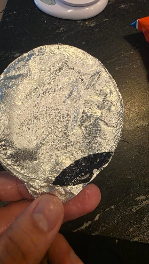 GraysonScogin's tweet photo. @Chobani my yogurt cup had a manufacturing defect where there was an additional slip of tin foil on the lid, which made it look closed but didn't actually seal it. Yogurt had gone bad

Can you hook me up with a coupon? https://t.co/EpS4w2SPVE