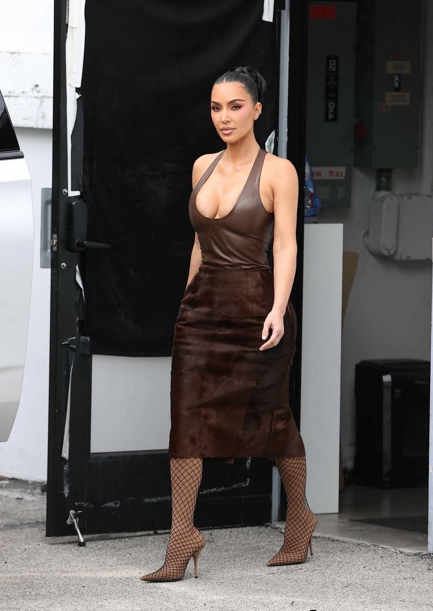 Kim Kardashian in a monochromatic brown look and her trusty Balenciaga by  Demna Pantalegging boots!