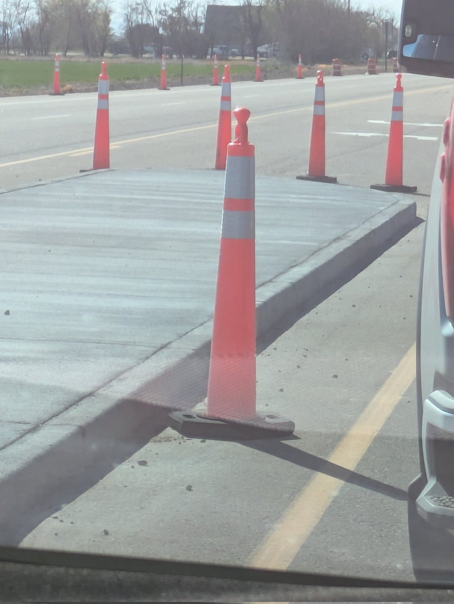 Whoever is responsible for putting these curb abominations in the middle turn lane deserves to spend the rest of their life in a subdivision (excuse me, gated community) full of the crankiest retired micromanagers.