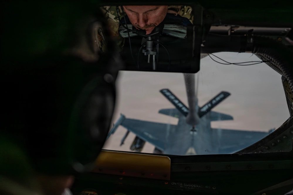 sentdefender's tweet photo. A U.S. Air Force KC-135R Stratotanker with the Wisconsin Air National Guard’s 128th Air Refueling Wing, based out of General Mitchell Air National Guard Base in Milwaukee, refuels F-16CM Fighting Falcons assigned to the 31st Fighter Wing out of the Aviano Air Base, Italy, over the U.S. Central Command Area-of-Responsibility in support of Operation Epic Fury, April 2, 2026.