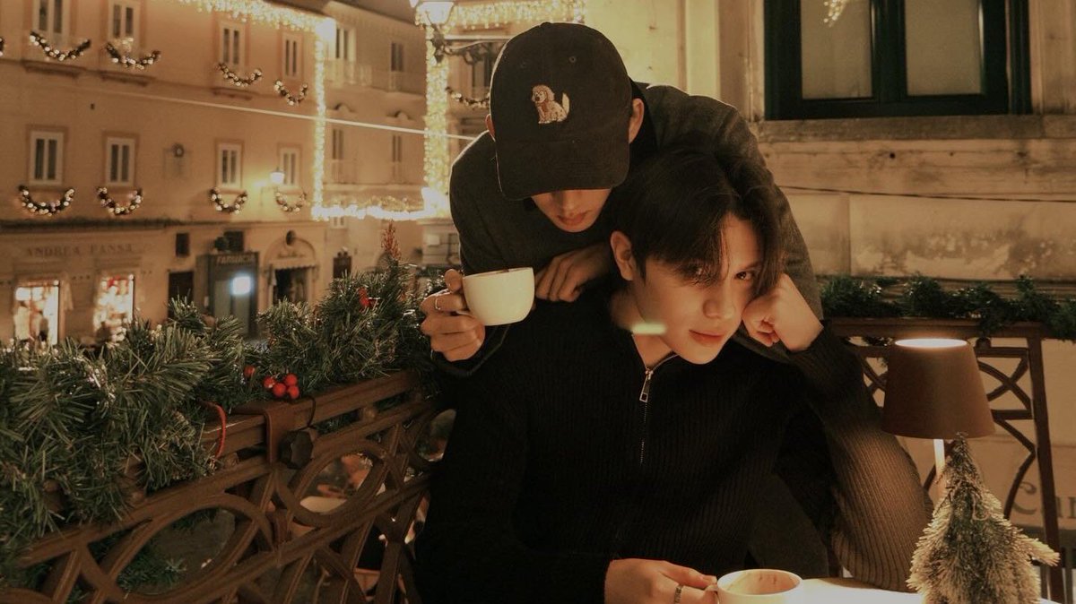 Corner booth, two steaming cups, and him practically glued to me like he’s my personal hoodie — clingy in the best way.