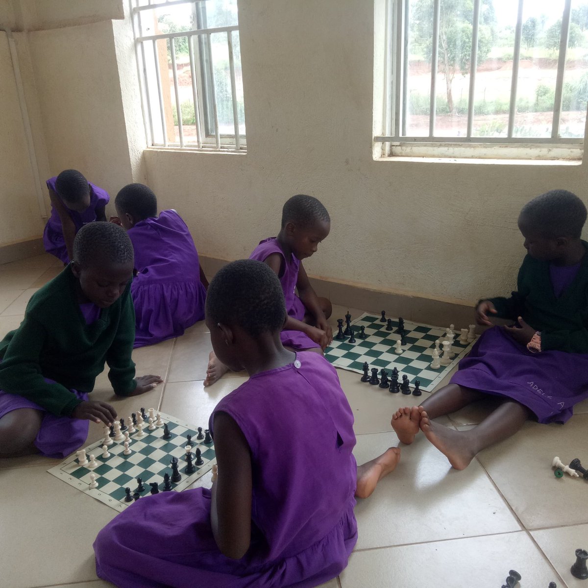 Clively times kids enjoying chess training at school.