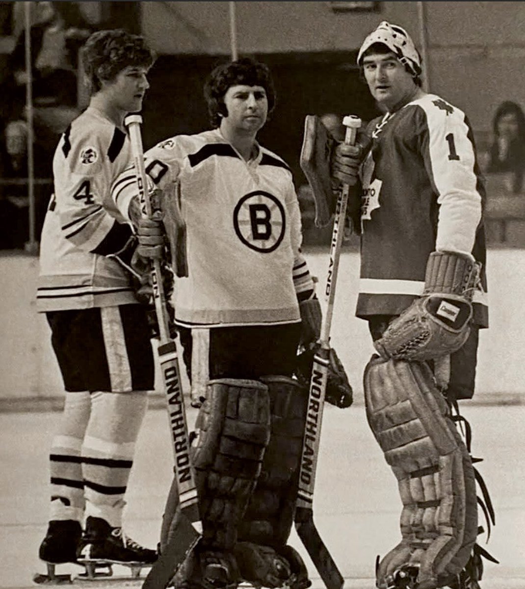 Berger_BYTES's tweet image. Apr. 10, 1974. #Boston Garden. Former #NHLBruins teammates Bobby Orr and (#Leafs goalie) Ed Johnston talk during the warmup to Game 1 of the #StanleyCup quarterfinals. Bruins goalie Ross Brooks is between them. Boston swept #Toronto in four straight and lost to the #Flyers in the