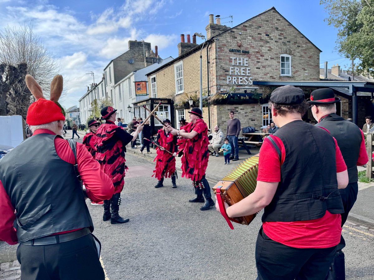 RedCuthbert's tweet photo. Here are some photos and a video of Red Cuthbert #Morris enjoying a windy Easter Saturday dance‑out, touring #Cambridge pubs with sticks, bells, and battling the breeze with style. 
https://t.co/yHlE527ROU https://t.co/HRkQ3WQGlq