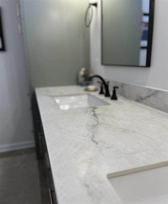 DreamMakerA2's tweet photo. Showplace cabinets and porcelain countertops set a solid, clean base. The lighting is a little different in the best way and pulls the whole space together. Shout out to @jessica_dreammaker for designing a bathroom the client loves. https://t.co/KlvOdGsAHm