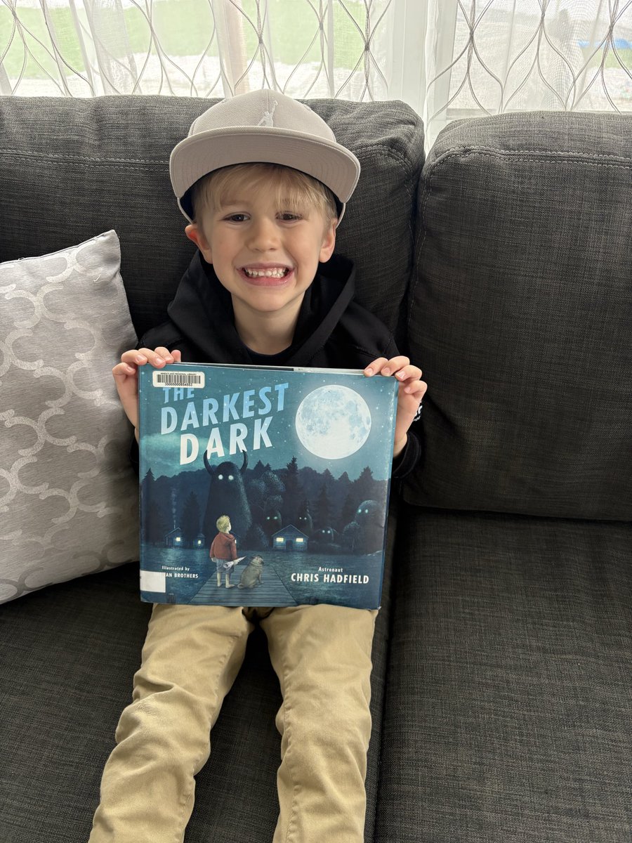 TravisGM26's tweet photo. @Cmdr_Hadfield @csa_asc 

#Thedarkesthour #ArtemisII #Neptunebeach

I was lucky enough to be in Florida last week on a work trip. The kids were almost more excited than I was as a guy from the middle of Sask with a deep interest in space.  My son re-checked out his favorite book! https://t.co/Hk2qXZF1Zr