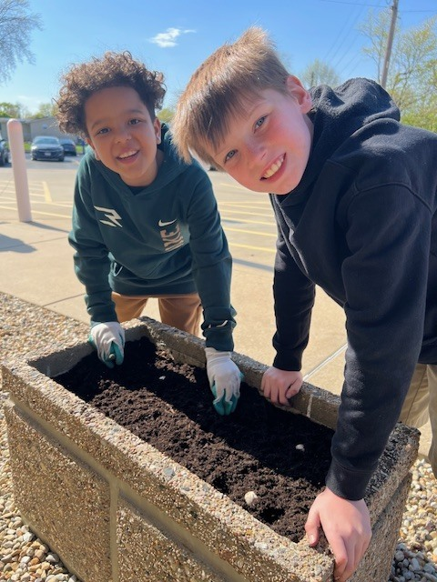 pwh105's tweet photo. Our AMAZING Green Team worked hard to freshen up the planters for spring. They made wildflower seed bombs at their last meeting, and today they got to plant them. We can’t wait to see the color they bring! Many thanks to Mrs. Clark and the  Green Team!! https://t.co/wsbeFfJLKy