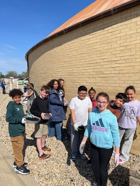 pwh105's tweet photo. Our AMAZING Green Team worked hard to freshen up the planters for spring. They made wildflower seed bombs at their last meeting, and today they got to plant them. We can’t wait to see the color they bring! Many thanks to Mrs. Clark and the  Green Team!! https://t.co/wsbeFfJLKy