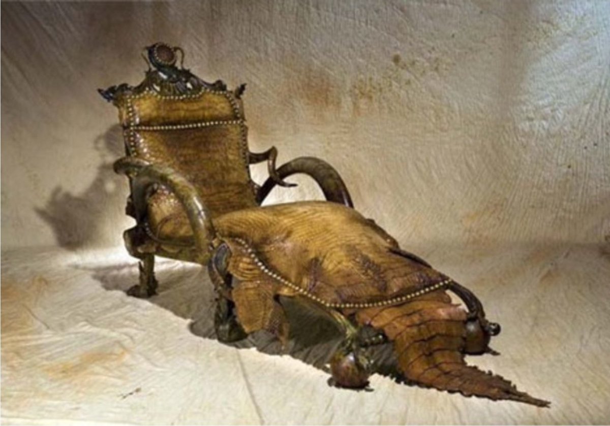 Kairo_Anatomika's tweet photo. I saw a article on Taxidermy furniture, and was surprised that in all of the furniture made from alligator skin, the animal's cloaca (the anal/genital opening) was prominently featured.

I wondered if this was some sort furniture design norm and looked into it.

It turns out that all of these pieces are the works of a single artist. That simultaneously explains everything but also nothing at all.