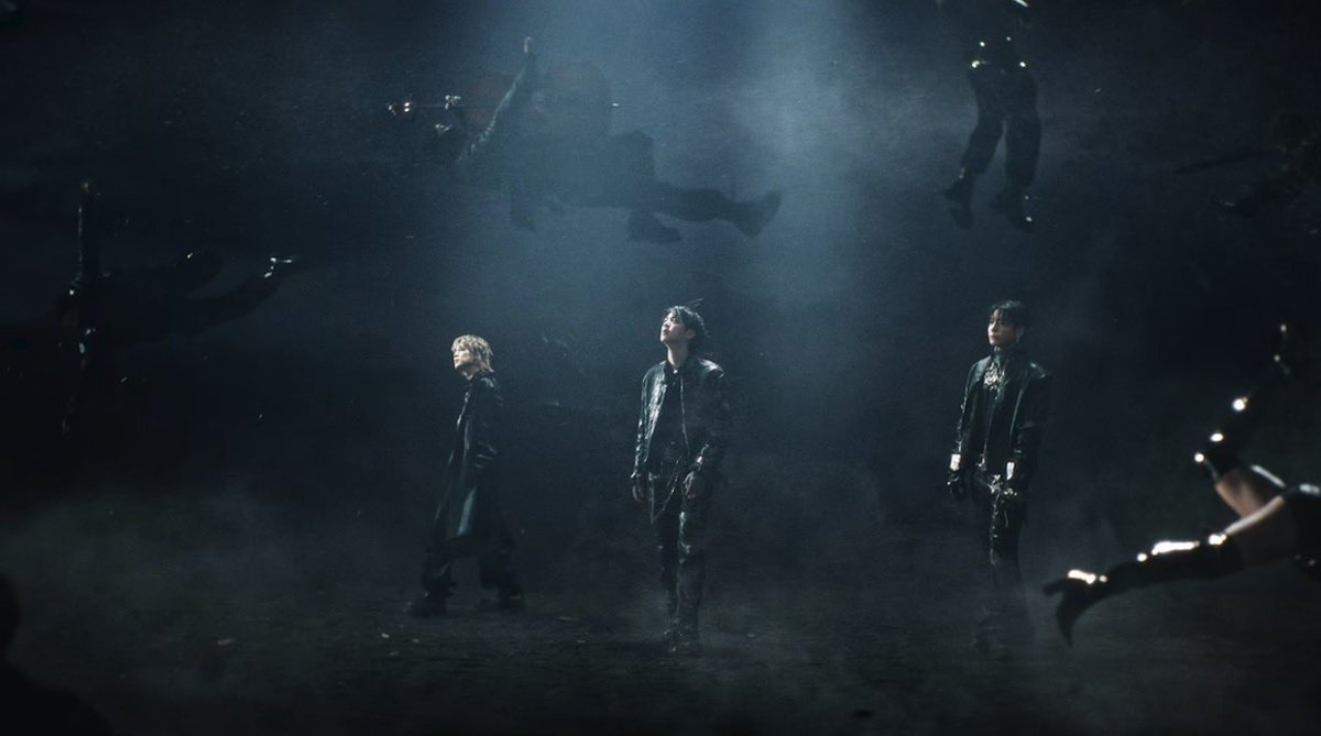 btsbloomdiary's tweet photo. now that i’m more calm from all the freak outs (yes after a night passed) and after rewatching the hooligan mv again, it feels like we’re not watching chaos happen, we’re walking through the aftermath of it. 

those black plastic bags lining the walls look like trash bags at first, but the longer you look the more they feel like body bags, like something has already been destroyed or discarded. 

the swordswoman moving through that space, calm and precise, not overwhelmed but completely in control, like she understands the destruction or even caused it. when she’s outside with the swords, it reinforces that she’s not chaotic, she’s intentional like she’s the embodiment of “때려 부숴 like hooligan”

and when the bodies are suspended in the air, like gravity is gone and reality itself is distorted, “what’s the future? “where’s the now?” - bts remain grounded. they’re not caught in the chaos, they’re standing within it.

so when you connect the lyrics - “we pop out, we actin’ a fool again” and “통제불능, 머리 춤”, it sounds like losing control, but the visuals show the opposite. it feels like understanding the chaos so deeply that they can move through it without being consumed.

hooligan isn’t mindless rebellion, it’s transformation. it’s them breaking the system, mastering the chaos and standing in the aftermath completely unfazed.