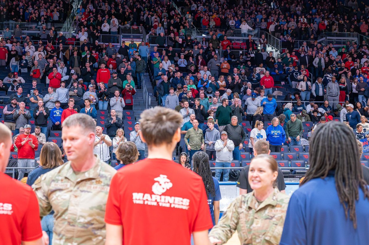 DaytonHoopla's tweet photo. The swearing-in ceremony during the #FirstFour gives us chills every year. It's an honor to celebrate these brave men and women in front of a packed crowd at UD Arena!

#TheRoadStartsHere #MarchMadness https://t.co/eyFNlZjrT9