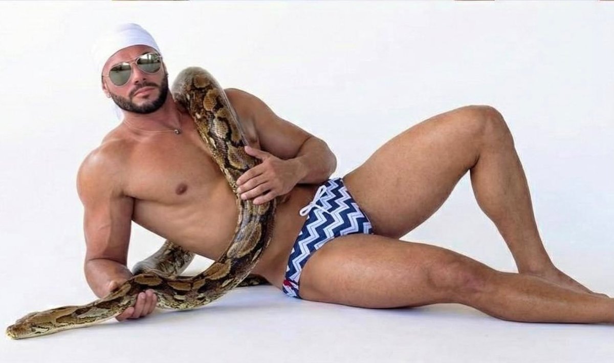 Jose Morillo rests with a giant python... ❤️ 🔥 🐍